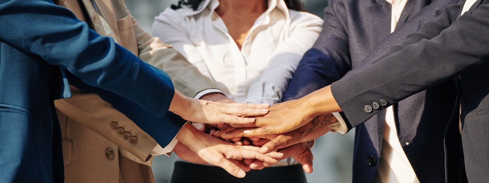 business-team-stacking-hands-2021-08-27-17-18-27-utc (1)